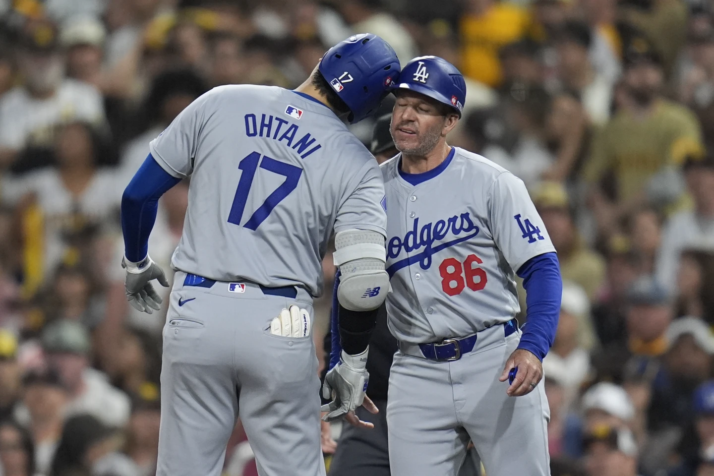 Betts and Ohtani lead the Los Angeles Dodgers to an 8-0 victory over the San Diego Padres, keeping their hopes alive in the NLDS