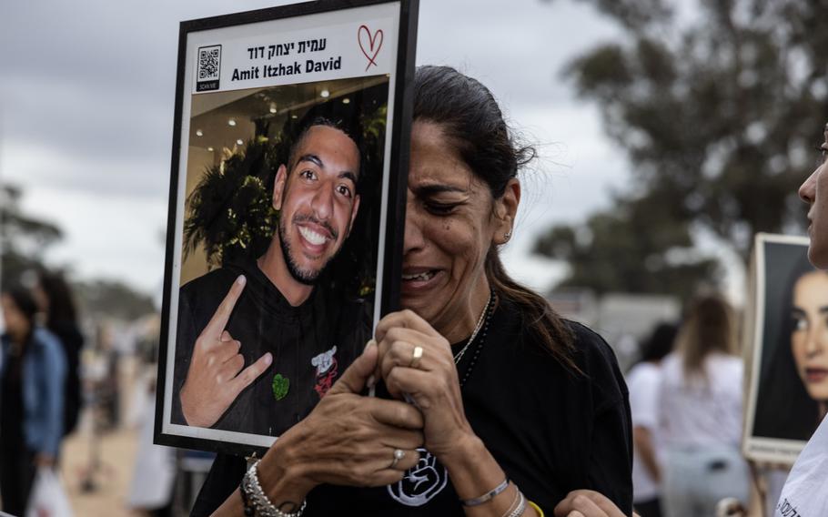 Israelis, still at war, pause to remember the attacks of 1 year ago